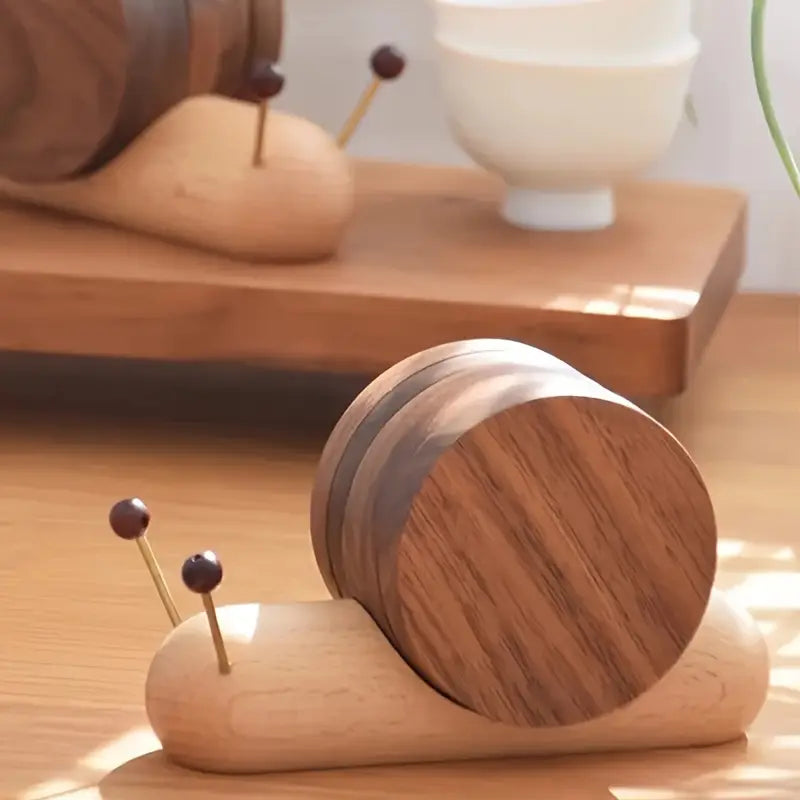 Wooden pin holder shaped like a caterpillar on a wooden surface