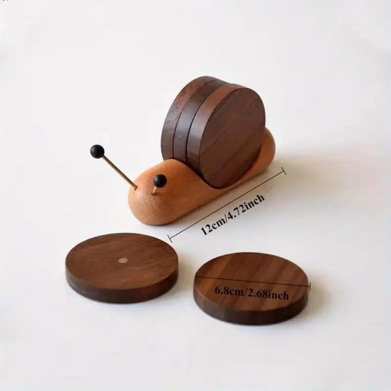 Wooden toy snail with measurements on a white background